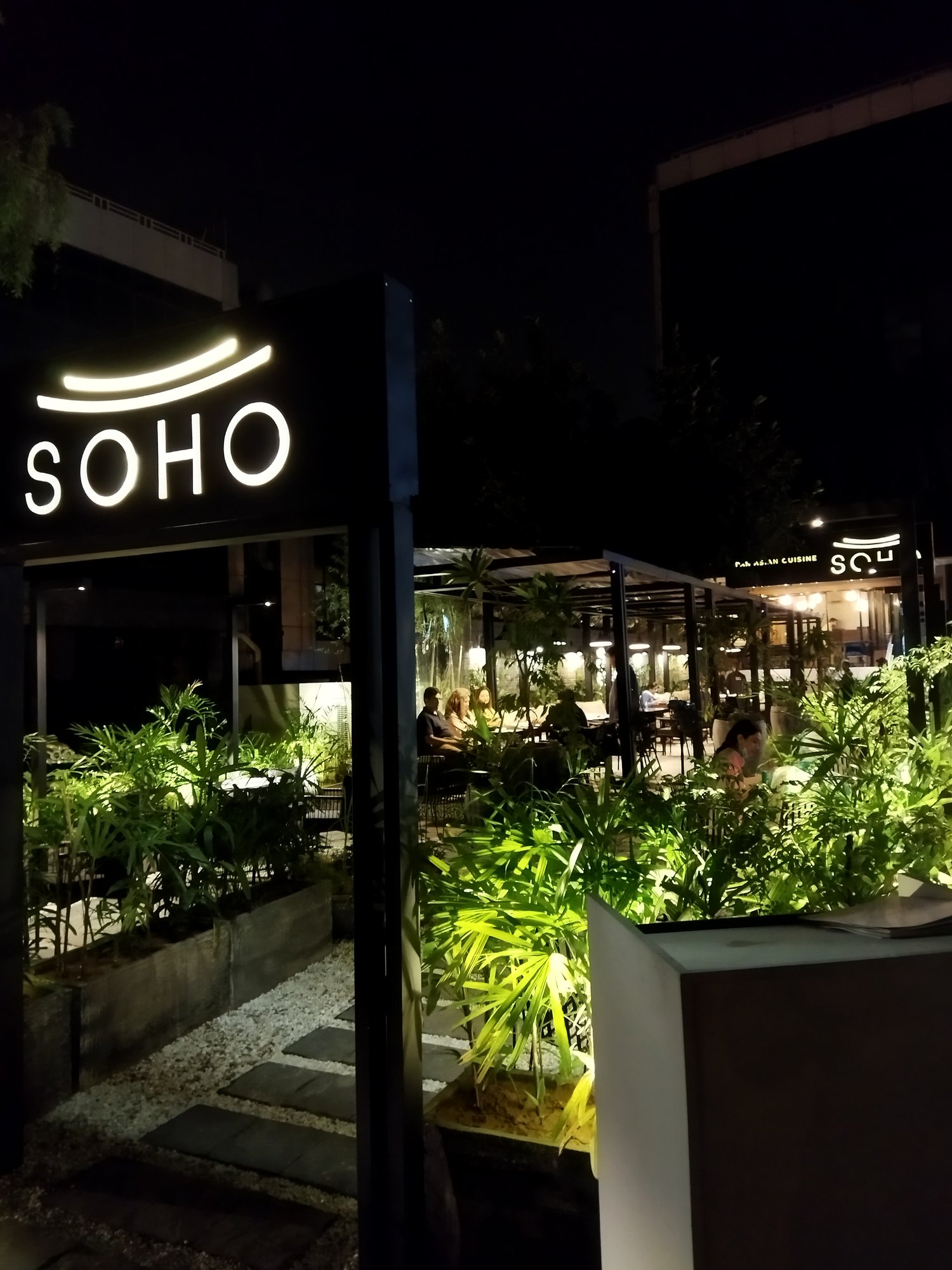 SOHO entrance signage, brightly lit